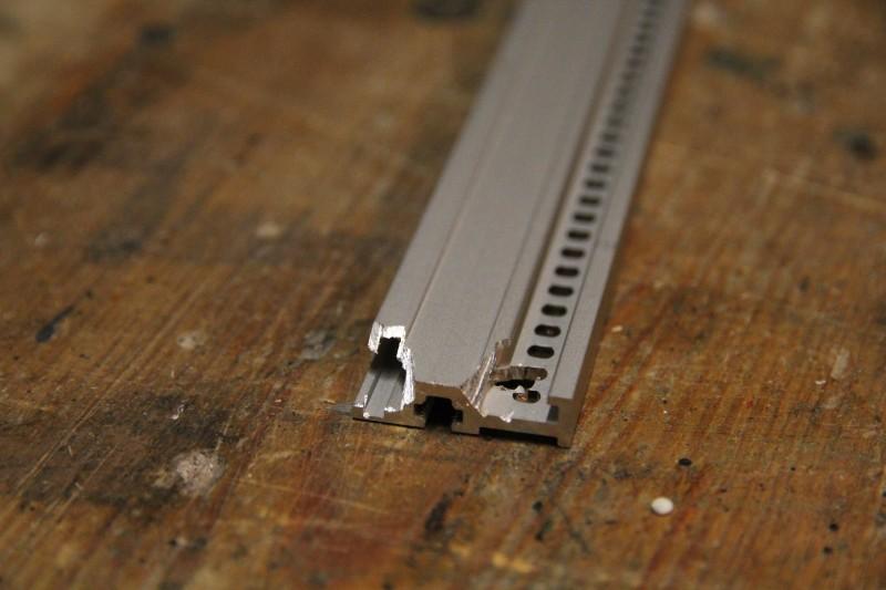 Rail from top side of the modular suitcase with edges sawn off